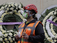 Rescuer carries out a guard in memory of the girls and boys who died at the Rébsamen School in Mexico City after a building collapsed during...
