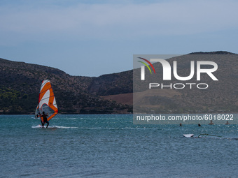 Warm and windy Septembers are perfect for windsurfing. In Athens, Greece, on September 20, 2020. (