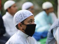 Muslim boy wearing a face mask takes part in Annual Conference amid COVID-19 (coronavirus) Pandemic Held at Jamia Islamia Quran in Sopore, D...