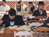 A group of Orthodox Jews praying on the last day of Rosh Hashanah, the Jewish New Year, in the synagogue at the Center for the History and C...