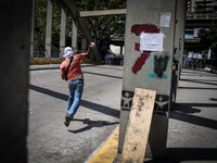 Venezuelan students protest against the government of President Nicolas Maduro in Caracas resulted with police intervention on March 20, 201...