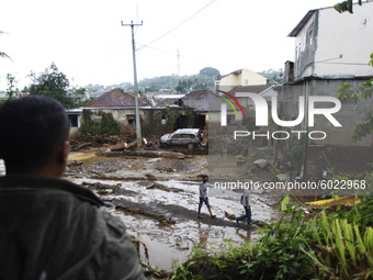 A car swept away by flash flood is seen on top of debris in Cibuntu, Pasawahan village in Sukabumi, West Java, on September 22, 2020, due to...