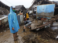 Resident cleaning mud and water away following  flash floods hit in Cibuntu, Pesawahan village in Sukabumi, West Java, Indonesia, on Septemb...