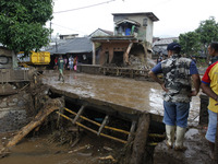 Shows damages on a bridge and a house in by flash flood in Cibuntu, Pesawahan village in Sukabumi, West Java, Indonesia, on September 22, 20...
