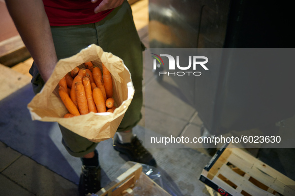 He just found 1kg of carrots. Tarin, a young man, searches for food in trash containers next to supermarkets. When needed he rides his bicyc...
