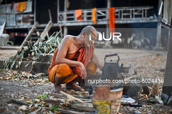 Portrait of a Buddhist Monk during prayer in Phnom Penh, Cambodia, in April 2016. 