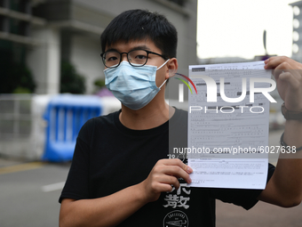 Pro-Democracy activists Joshua Wong holdsup his bail form  on September 24, 2020 in Hong Kong, China. Joshua Wong was arrested for taking pa...