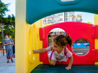 A little girl playing inside the kindergarten on the first day of school in Molfetta on 24 September 2020.
The return to school for childre...