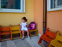 A little girl waiting outside the kindergarten on the first day of school in Molfetta on 24 September 2020.
The return to school for childr...