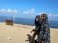 Two girls walk near the beach, amid the coronavirus disease (COVID-19) crisis, in the southern Gaza Strip, on September 24, 2020.  (