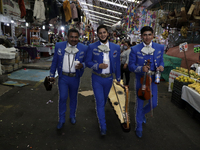 Mariachis walk the aisles of the Jamaica Market to celebrate the 63rd anniversary of the La Merced and Mixcalco Markets, which were founded...
