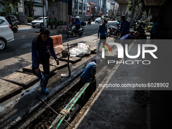 Workers working on Fibre Optice infrasturcture at South Jakarta on 24 September 2020. Jakarta's return to stricter social-distancing measure...