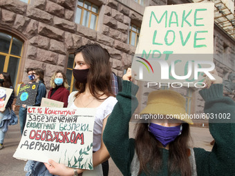 Protestors hold placards as they attend the 'Global Day of Climate Action' rally near the City Hall in Kyiv, Ukraine on 25 September 2020. U...
