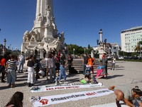 Demonstrators display posters denouncing pollution and the danger of climate change, at a meeting in Lisbon, Portugal. September 25th, 2020....