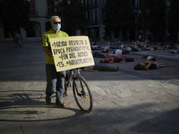 A man with a bike with a sign seen during a pacific concentration in Plaza del Carmen Square on September 25, 2020 in Granada, Spain. Follow...