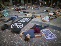 Protesters lying on the floor with signs during a pacific concentration in Plaza del Carmen Square on September 25, 2020 in Granada, Spain....