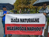 Protesters with a banner saying '' natural resources are property of the nation'' in the entrance of a coal mine in Ruda Slaska during a dem...