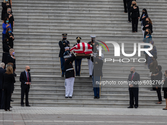 Women members of Congress look on as the casket of the late Supreme Court Associate Justice Ruth Bader Ginsburg is driven away following cer...