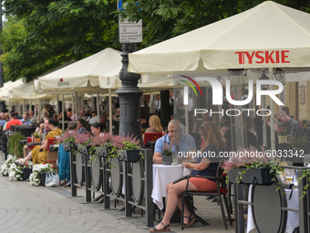 Busy restaurants in Krakow's Old Town with locals and visitors.
The number of COVID-19 infected in Poland is constantly growing, and two day...