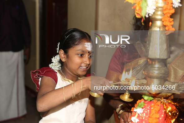 Tamil girl lights a lamp during a special cultural program featuring Tamil children who were orphaned during the civil war take part in a sp...