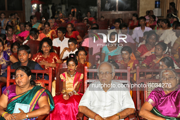 Tamil Hindus watch as Tamil children who were orphaned during the civil war take part in a special cultural program in Jaffna, Sri Lanka, on...