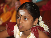 Tamil girl waits to perform in a special cultural program featuring Tamil children who were orphaned during the civil war in Jaffna, Sri Lan...