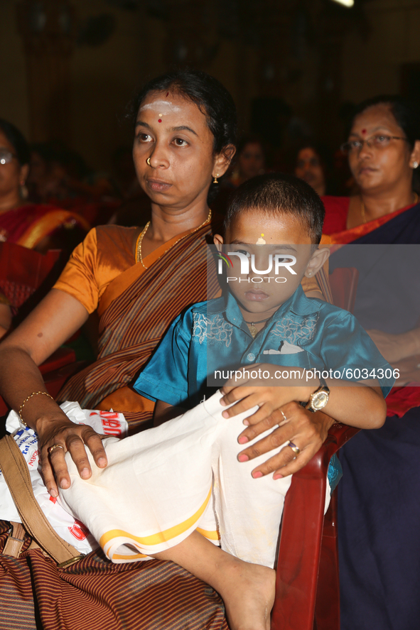 Tamil Hindus watch as Tamil children who were orphaned during the civil war take part in a special cultural program in Jaffna, Sri Lanka, on...