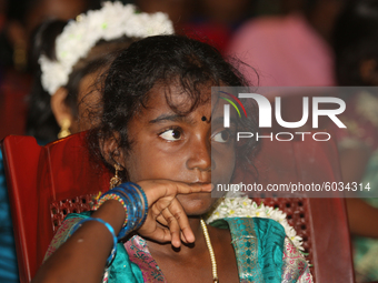 Tamil girl waits to perform in a special cultural program featuring Tamil children who were orphaned during the civil war in Jaffna, Sri Lan...