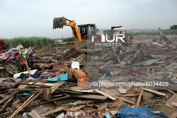 A view of demolished slum dwellings after demolition drive by the Delhi Development Authority (DDA) against encroachments at Jamia Nagar's D...
