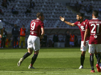 Andrea Belotti of Torino FC celebrates with teammates after scoring during the Serie A football match between Torino FC and Atalanta BC at O...