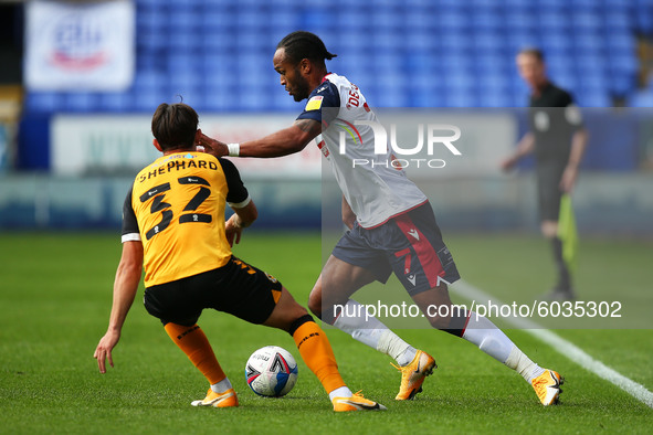   Boltons Nathan Delfounesco gets passed Newports Liam Shephard during the Sky Bet League 2 match between Bolton Wanderers and Newport Count...