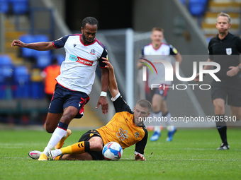  Nathan Delfounesco battles with Newports Ryan Taylor  during the Sky Bet League 2 match between Bolton Wanderers and Newport County at the...