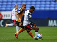  Boltons Brandon Comley holds off Newports Ryan Haynes during the Sky Bet League 2 match between Bolton Wanderers and Newport County at the...