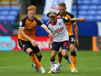  Newports Ryan Taylor battles with Boltons Lloyd Isgrove during the Sky Bet League 2 match between Bolton Wanderers and Newport County at th...