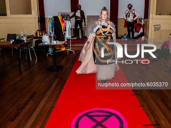 XR models are getting ready for the catwalk the launch of 'Nopulence', the first activist clothing collection by Extinction Rebellion during...