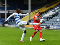 Osman Kakay and Marvin Johnson in action during the Sky Bet Championship match between Queens Park Rangers and Middlesbrough at The Kiyan Pr...