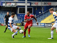 Britt Assombalonga and Yoann Barbet in action during the Sky Bet Championship match between Queens Park Rangers and Middlesbrough at The Kiy...