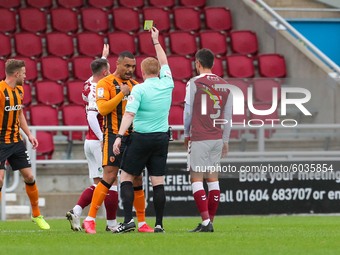 Referee Alan Young shows a yellow card to Hull City's Josh Magennis during the first half of the Sky Bet League One match between Northampt...