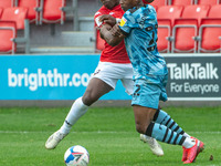 
 Brandon Thomas-Asante of Salford City FC and Udoka Godwin-Malife of Forest Green Rovers clash during the Sky Bet League 2 match between S...
