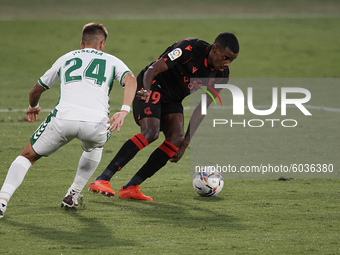 Alexander Isak of Real Sociedad and Josema of Elche compete for the ball during the La Liga Santader match between Elche CF and Real Socieda...