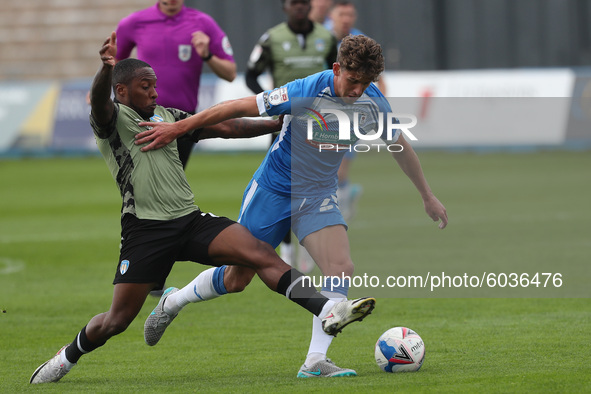   Callum Harriott of Colchester United fouls Barrow's Harrison Biggins    during the Sky Bet League 2 match between Barrow and Colchester Un...