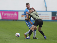    Scott Quigley of Barrow and Tommy Smith of Colchester United   during the Sky Bet League 2 match between Barrow and Colchester United at...