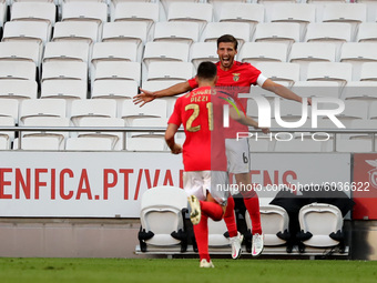 Ruben Dias of SL Benfica (R ) celebrates with Pizzi after scoring during the Portuguese League football match between SL Benfica and Moreire...