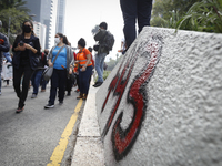 Normalistas students painted the street during a demonstration to commemorate the sixth anniversary of the disappearance of the 43 Ayotzinap...