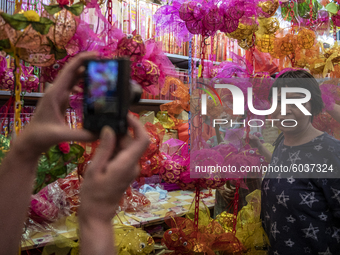 A women is seen posing for a photo with lanterns on September 26, 2020 in Hong Kong, China. Mid-Autumn Festival also known as the Lantern Fe...