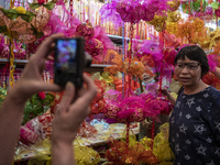 A women is seen posing for a photo with lanterns on September 26, 2020 in Hong Kong, China. Mid-Autumn Festival also known as the Lantern Fe...