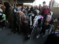 Palestinians wait to cross to the Egyptian side of Rafah border crossing in the southern Gaza Strip on September 27, 2020.  (