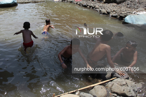 Indonesian children playing at the Ciliwung river in Bogor, West Java, 27 September 2020. World Rivers Day (WORD) is celebrated yearly on th...