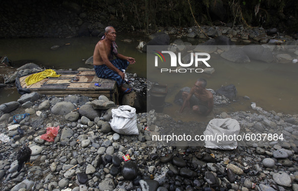 A man is seen cleaning at the Ciliwung river in Bogor, West Java, 27 September 2020. World Rivers Day (WORD) is celebrated yearly on the fou...