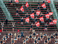 The University of Cincinnati cheerleaders and drill team perform during an NCAA college football game at Nippert Stadium between the Univers...